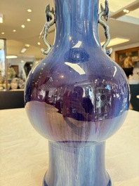 A Chinese flamb&eacute;-glazed garlic-mouth vase with ruyi handles, 19th C.