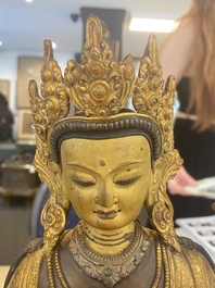 A Tibetan or Nepalese turquoise-inlaid partly-gilt bronze figure of White Tara, 20th C.