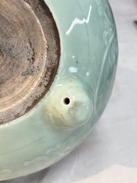A Chinese celadon-glazed tripod censer with floral anhua design, 18/19th C.