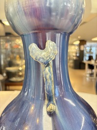 A Chinese flamb&eacute;-glazed garlic-mouth vase with ruyi handles, 19th C.
