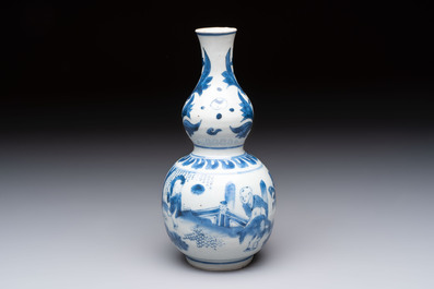 A Chinese blue and white 'playing boys' double gourd vase, Transitional period
