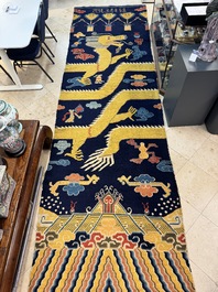 A Sino-Tibetan inscribed woollen 'dragon' pillar carpet, 19th C.
