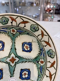 A polychrome Iznik pottery dish with stylised floral design, Turkey, ca. 1600