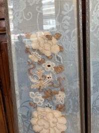 A fine Chinese kesi square 'dragon' panel and two silk embroideries with floral design, 19th C.