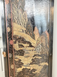 A Chinese Coromandel lacquered four-panel folding screen with mountainous landscapes, 17/18th C.