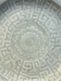 Three Chinese celadon-glazed plates with floral anhua design, 18/19th C.