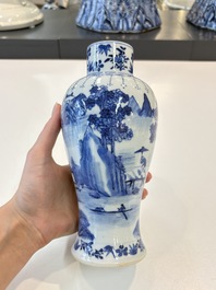 A Chinese blue and white garniture of five vases with landscape design, 19th C.