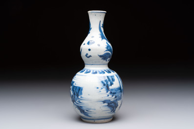 A Chinese blue and white 'playing boys' double gourd vase, Transitional period