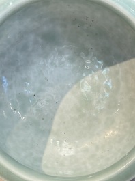 A Chinese celadon-glazed tripod censer with floral anhua design, 18/19th C.