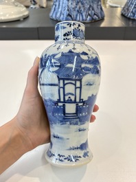 A Chinese blue and white garniture of five vases with landscape design, 19th C.