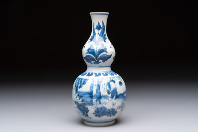 A Chinese blue and white 'playing boys' double gourd vase, Transitional period