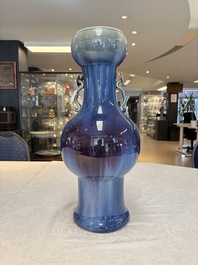 A Chinese flamb&eacute;-glazed garlic-mouth vase with ruyi handles, 19th C.