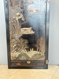 A Chinese Coromandel lacquered four-panel folding screen with mountainous landscapes, 17/18th C.