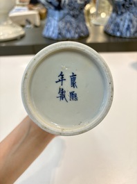 A Chinese blue and white garniture of five vases with landscape design, 19th C.