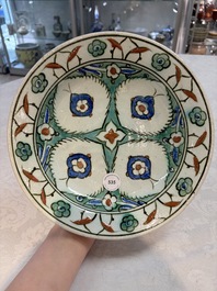 A polychrome Iznik pottery dish with stylised floral design, Turkey, ca. 1600