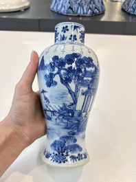 A Chinese blue and white garniture of five vases with landscape design, 19th C.