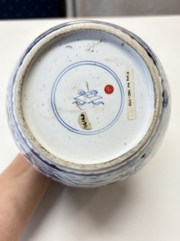 A Chinese blue and white 'birds among flowers' vase and cover, Kangxi