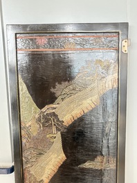 A Chinese Coromandel lacquered four-panel folding screen with mountainous landscapes, 17/18th C.