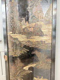 A Chinese Coromandel lacquered four-panel folding screen with mountainous landscapes, 17/18th C.