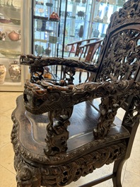 A pair of Chinese finely carved hongmu armchairs, Canton, 19th C.