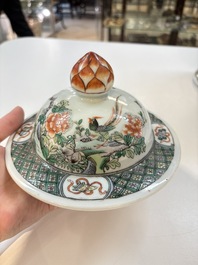 A Chinese famille verte 'phoenixes' vase and cover, 19th C.