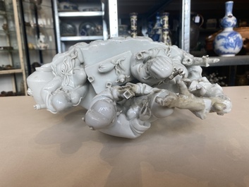 A Chinese Dehua blanc de Chine group of four deities on a boat, Republic