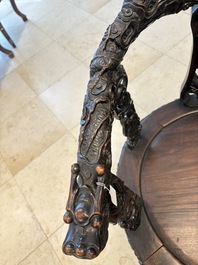 A pair of Chinese finely carved hongmu swivel chairs, Canton, 19th C.