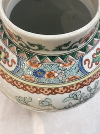 Two Chinese famille verte 'birds and flowers' vases and covers, 19th C.