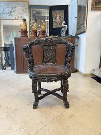 A pair of Chinese finely carved hongmu swivel chairs, Canton, 19th C.