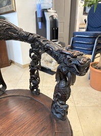 A pair of Chinese finely carved hongmu swivel chairs, Canton, 19th C.