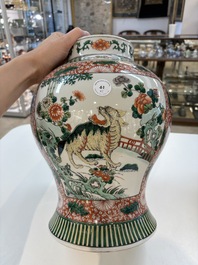 Two Chinese famille verte 'flowers and mythical animals' vases, 19th C.