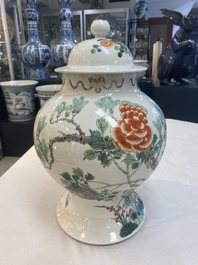 Two Chinese famille verte 'birds and flowers' vases and covers, 19th C.