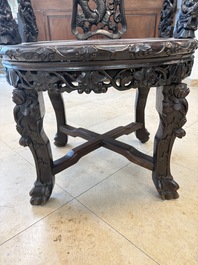 A pair of Chinese finely carved hongmu swivel chairs, Canton, 19th C.