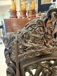 A pair of Chinese finely carved hongmu armchairs, Canton, 19th C.