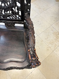 A pair of Chinese finely carved hongmu armchairs, Canton, 19th C.