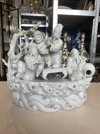 A Chinese Dehua blanc de Chine group of four deities on a boat, Republic