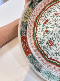 A Chinese wucai dish with floral design, Kangxi mark and of the period