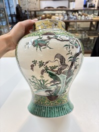 A pair of Chinese verte-biscuit 'cranes and flowers' vases and covers, 19th C.