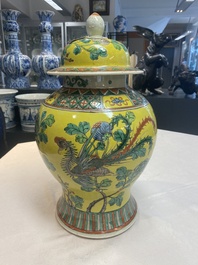 A pair of Chinese famille verte yellow-ground 'pheasants and peonies' vases and covers, 19th C.
