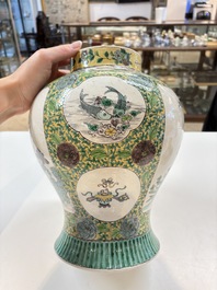 A pair of Chinese verte-biscuit 'cranes and flowers' vases and covers, 19th C.