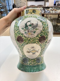 A pair of Chinese verte-biscuit 'cranes and flowers' vases and covers, 19th C.