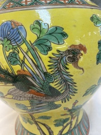 A pair of Chinese famille verte yellow-ground 'pheasants and peonies' vases and covers, 19th C.