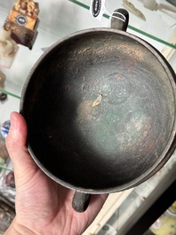 A Chinese archaic bronze tripod food vessel, 'dun 敦', Eastern Zhou