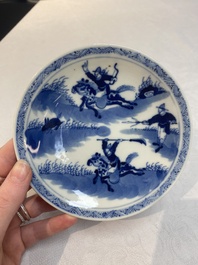 A set of 11 Chinese blue and white 'rabbit hunt' cups and saucers, Qianlong mark, 19th C.