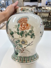 A Chinese famille verte 'phoenixes' vase and cover, 19th C.