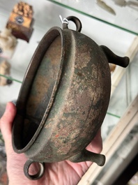 A Chinese archaic bronze tripod food vessel, 'dun 敦', Eastern Zhou