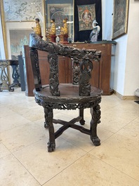 A pair of Chinese finely carved hongmu swivel chairs, Canton, 19th C.