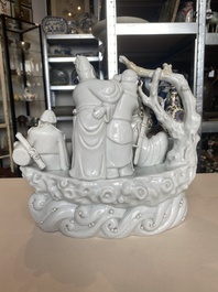 A Chinese Dehua blanc de Chine group of four deities on a boat, Republic