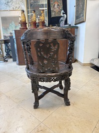 A pair of Chinese finely carved hongmu swivel chairs, Canton, 19th C.