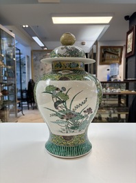A pair of Chinese verte-biscuit 'cranes and flowers' vases and covers, 19th C.